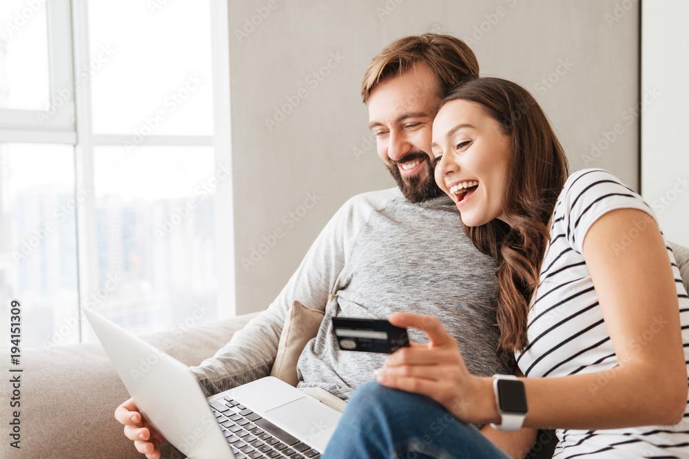 Couple getting an instant roof estimate and buying their new roof online.