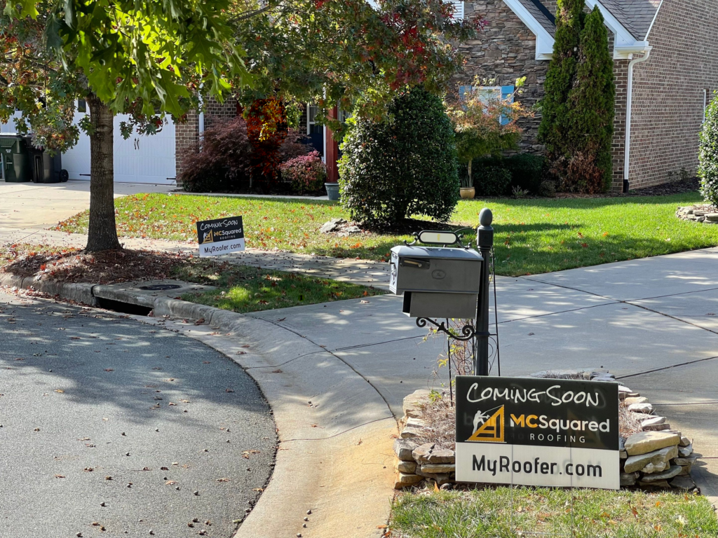 Yard signs for MCSquared Roofing at roof installation jobs in Burlington NC