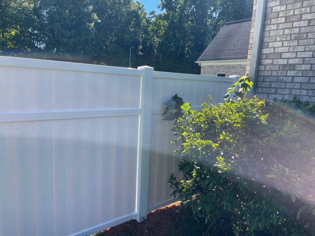 MCSquared Roofing white vinyl privacy fence installed in Burlington, NC area