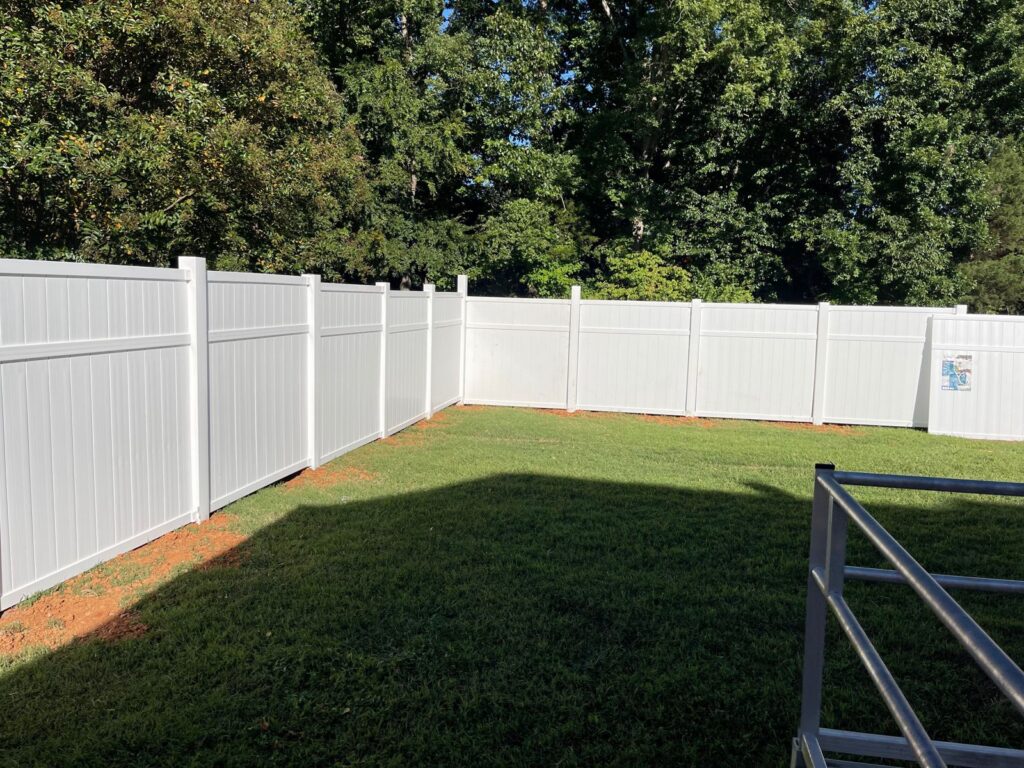 MCSquared Roofing white vinyl privacy fence installed in Burlington, NC area