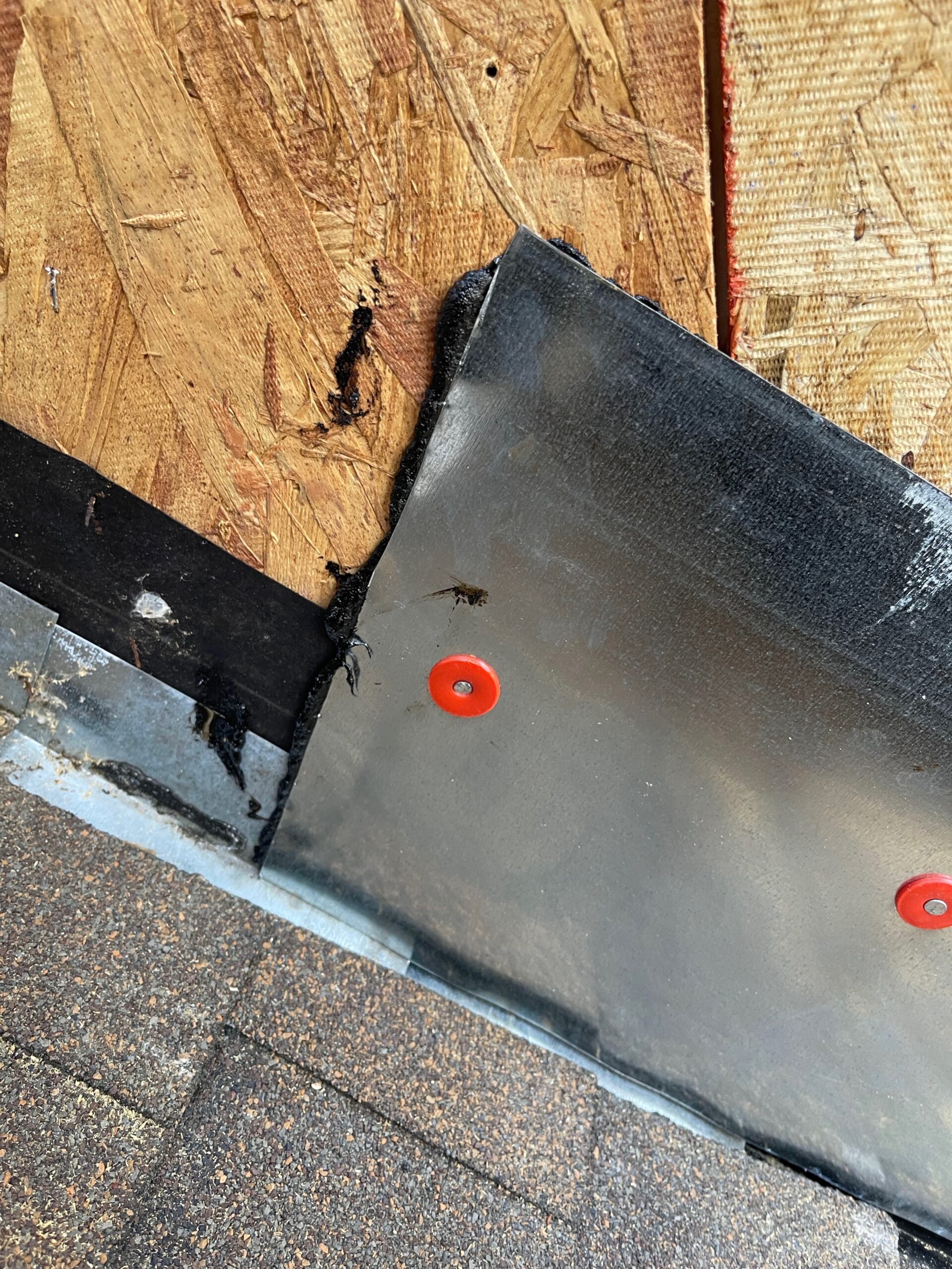 Close-up of a properly sealed roof flashing corner installed by MCSquared Roofing